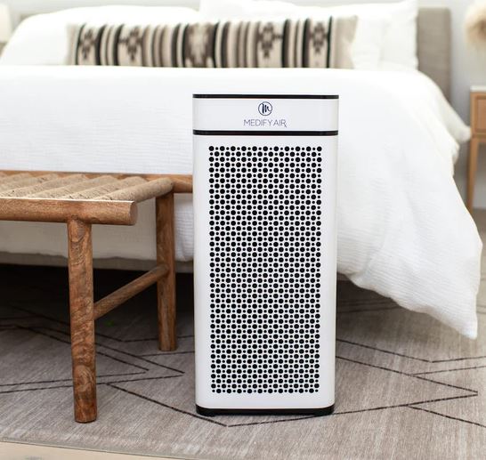 Energy-efficient Medify MA-40 air purifier placed in a quiet bedroom.