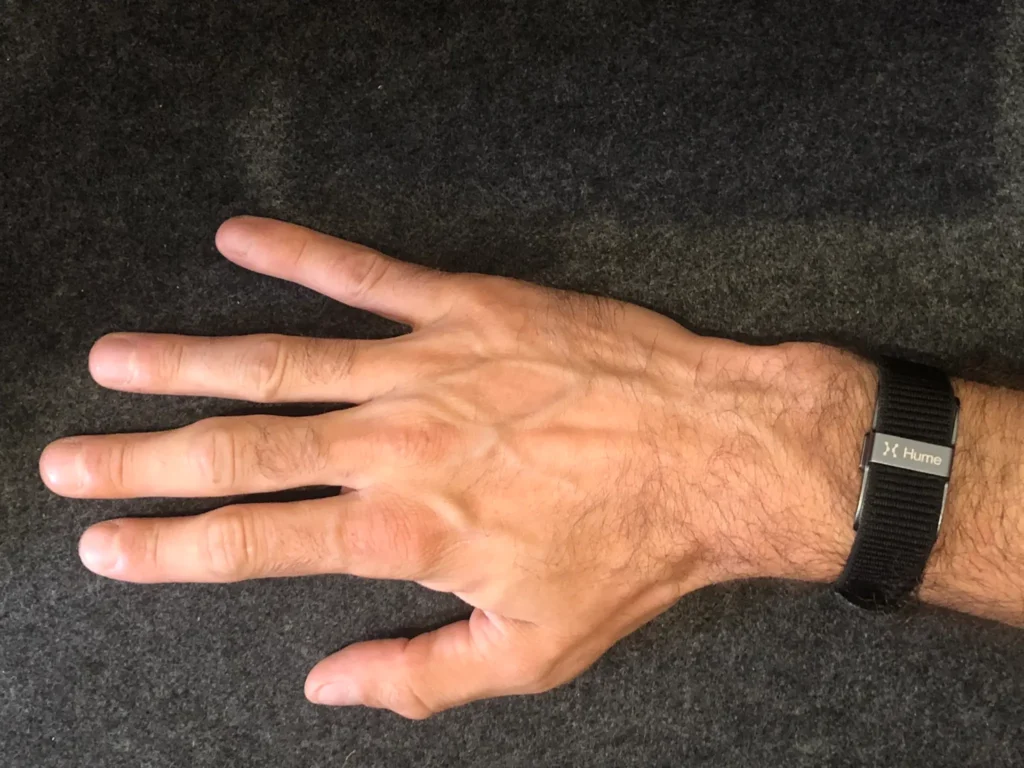Hand wearing the Hume Band health tracking device