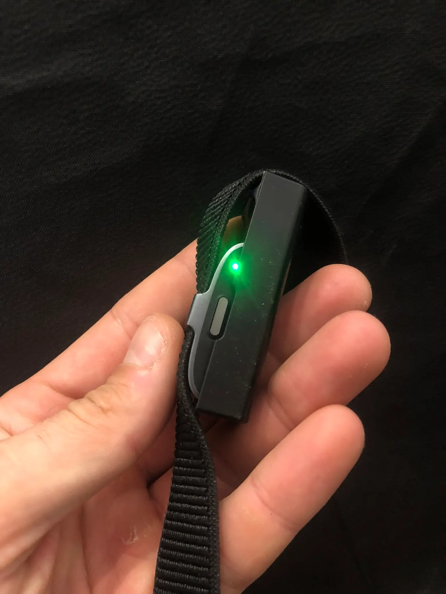 The green light on the side of the hume band means it is charging